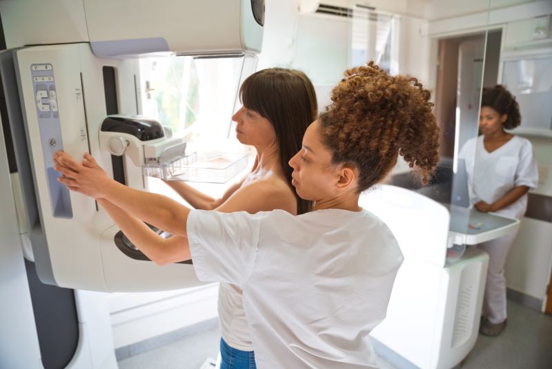 A woman getting a breast exam.