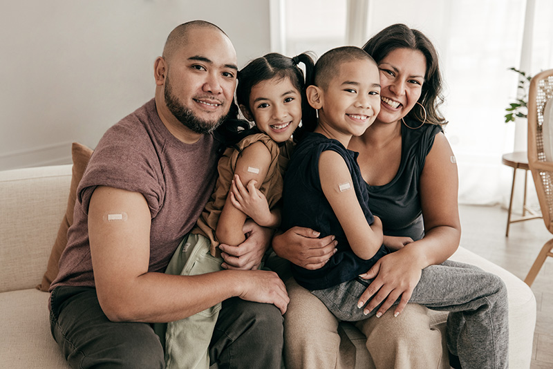 family of four on a couch